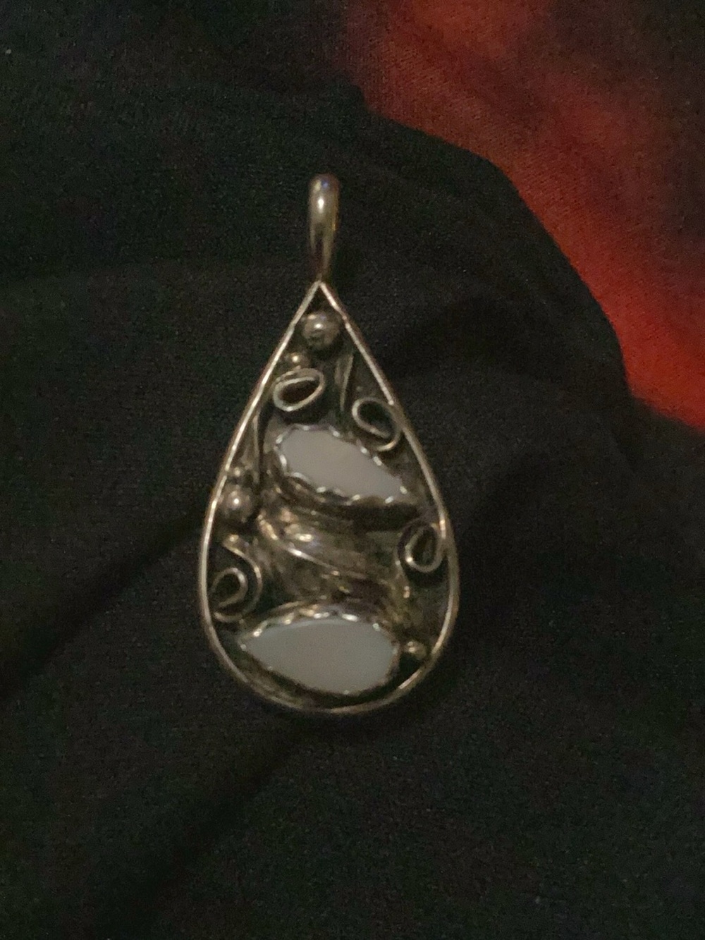 Native American signed sterling silver pendant featuring mother of pearl (MOP